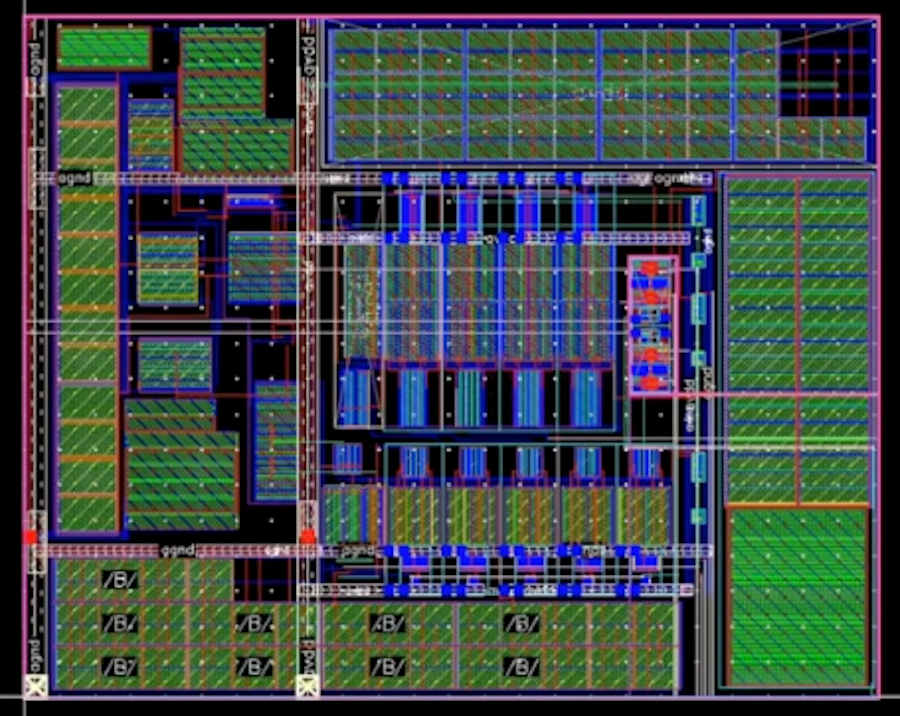 A detailed circuit board layout with various interconnected components, shown in a grid pattern. Sections are marked with different colors, indicating connections and pathways.