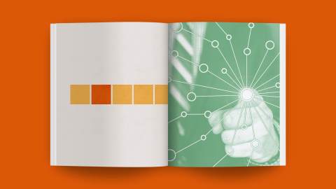 An open book with abstract designs: the left page displays a horizontal row of color blocks, while the right page features a hand touching a network of connected circles, highlighting strong connections.