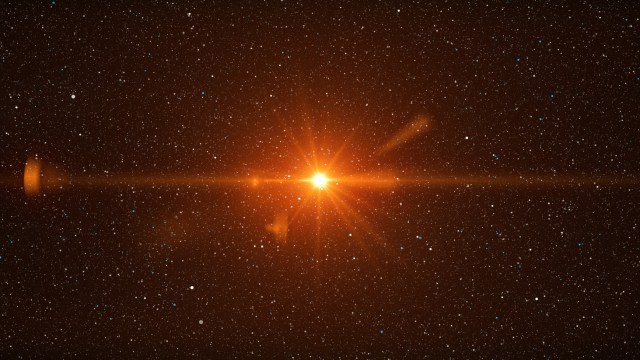 Bright orange star surrounded by a dense field of smaller white stars in space.