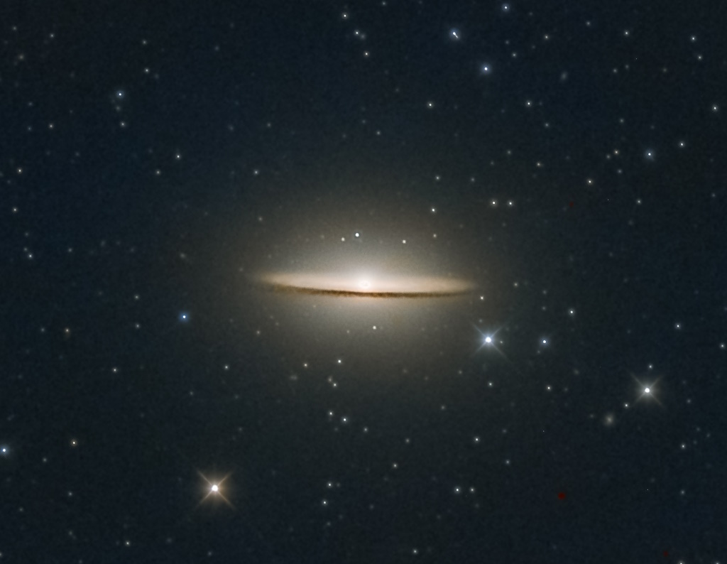 The JWST captures a breathtaking image of the Sombrero Galaxy, showcasing its bright core and thin, dark dust lane, all set against a backdrop of countless distant stars.