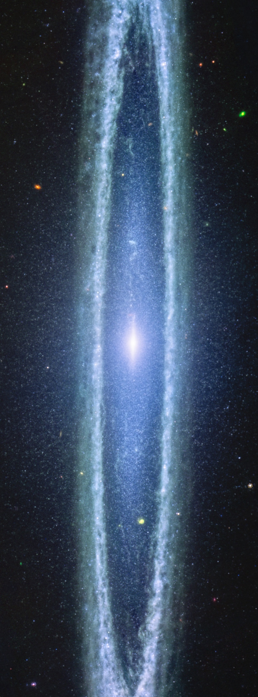 A vertical image of the Sombrero Galaxy, captured by the JWST, showcases a glowing center and elongated, halo-like structure surrounded by distant stars in space.