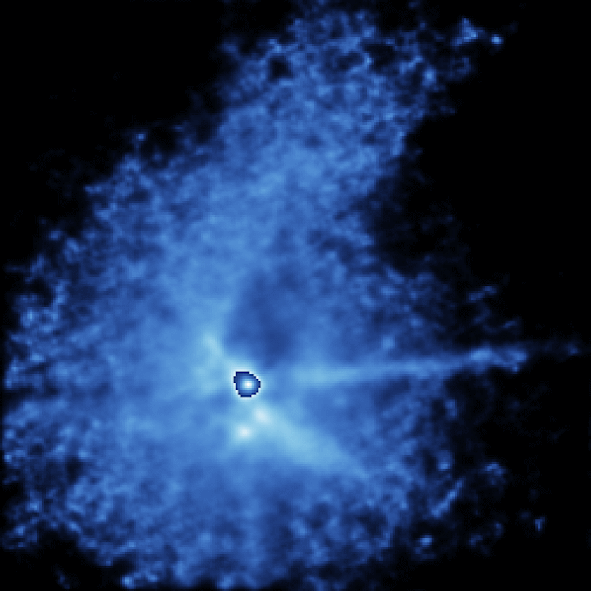 Bright blue gases and particles spread outward in a nebulous cloud against a dark background, with a brighter central area reminiscent of a dimming T Tauri star.