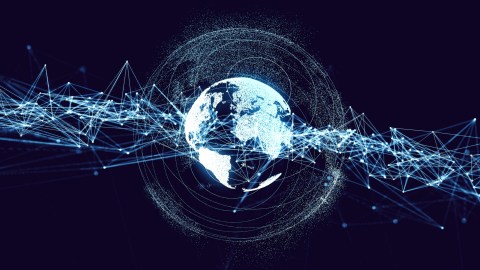 Digital rendering of Earth surrounded by network lines and particles, symbolizing global connectivity.