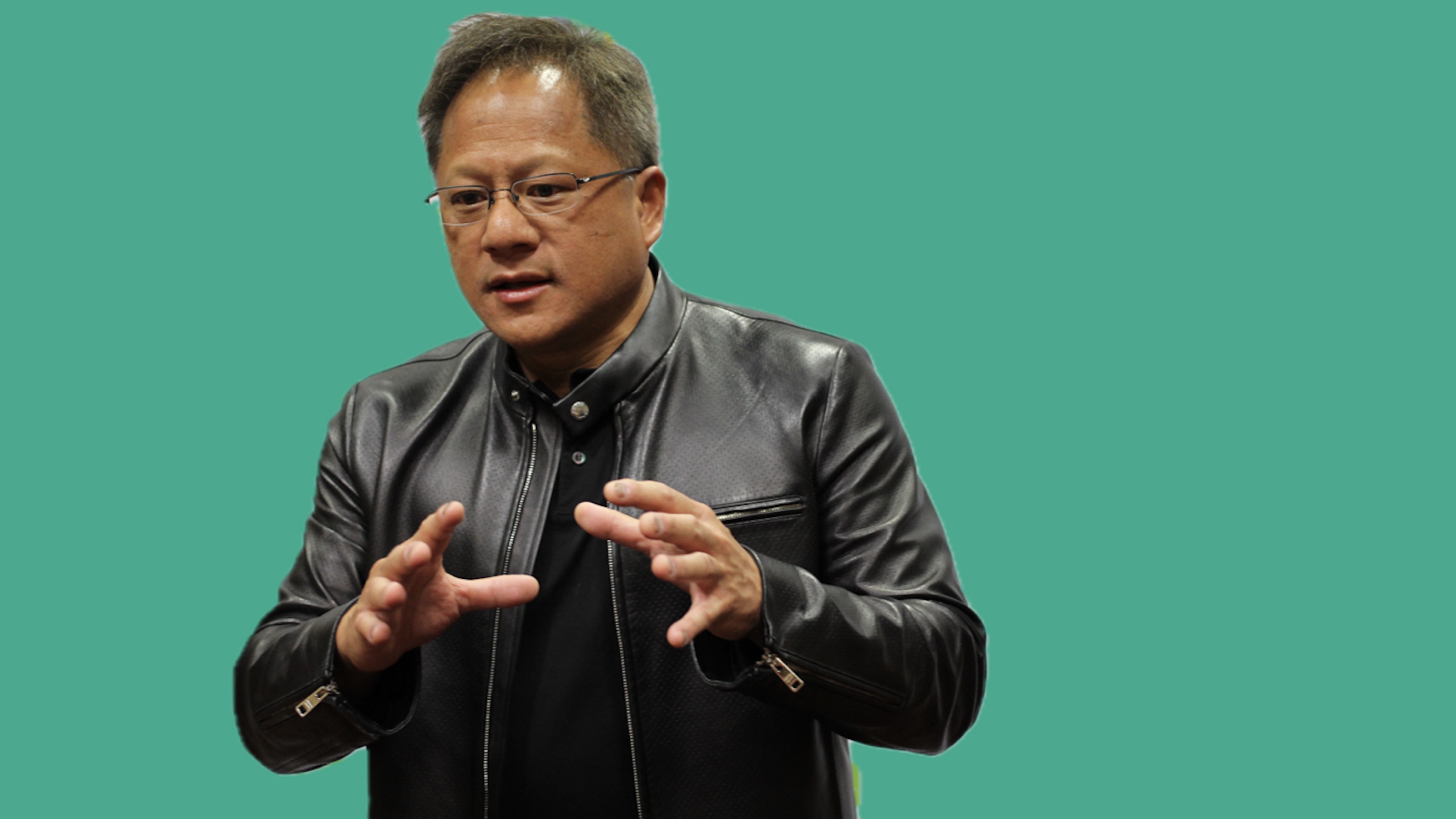 Person wearing a black leather jacket gestures with hands, striking a pose against a vibrant teal background, reminiscent of the sleek innovation NVIDIA embodies.