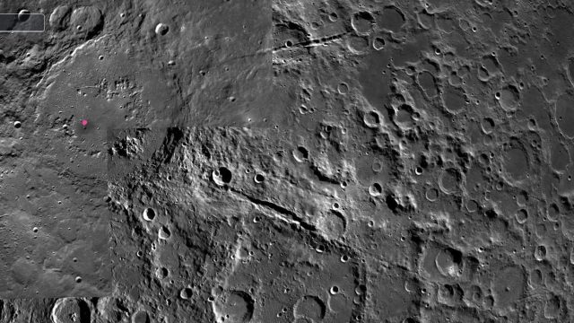 A grayscale image captures the moon's surface, featuring numerous craters of varying sizes. The scene is reminiscent of a lunar Grand Canyon, with a highlighted spot drawing the viewer's attention.