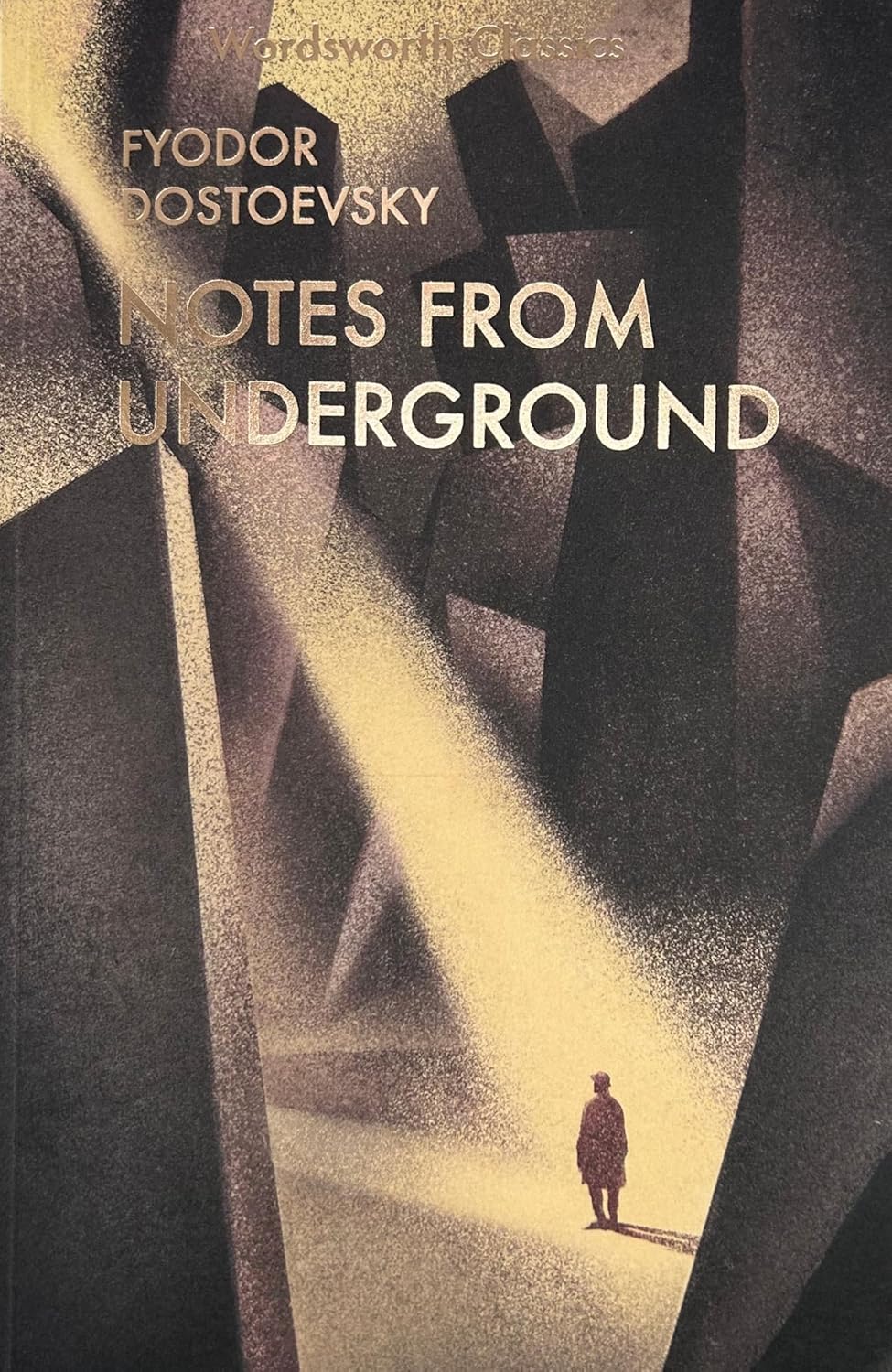 Book cover of &ldquo;Notes from Underground&rdquo; by Fyodor Dostoevsky, featuring a solitary figure standing among abstract, towering shapes with a beam of light illuminating the scene.